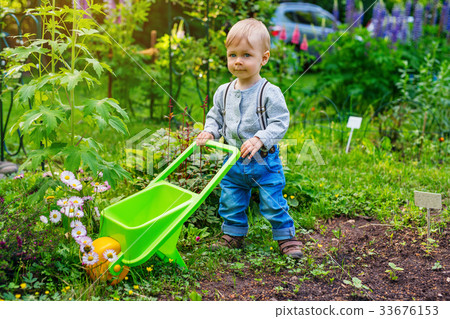 Child in summer garden 33676153