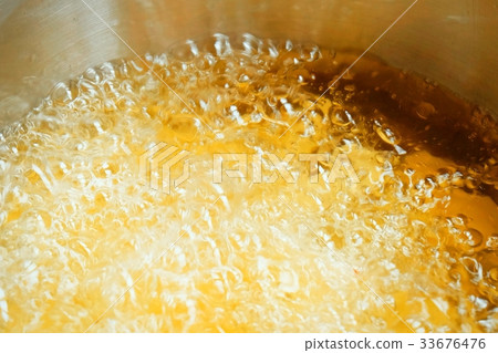 Golden Texture of Hot Bubbling Boiling Oil 33676476