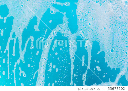 soap foam on a blue background soap foam on a blue background 33677202