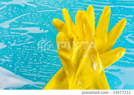 gloves in foam on a blue background gloves in foam on a blue background 33677212