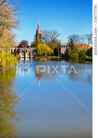 Spring in Bruges, Belgium, lake, medieval houses 33677395