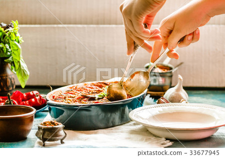 Ratatouille in a crockery on blue rustic, serving 33677945