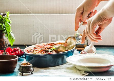 Ratatouille in a crockery on blue rustic, serving 33677946