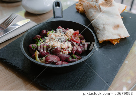 Fried beans in a frying pan Fried beans in a frying pan 33679098