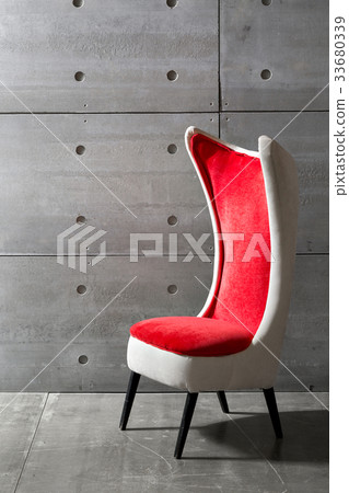 modern red chair and concrete wall. copy space 33680339