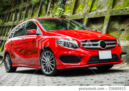 Landscape of a protective wall with red car and moss Landscape of a protective wall with red car and moss 33680915