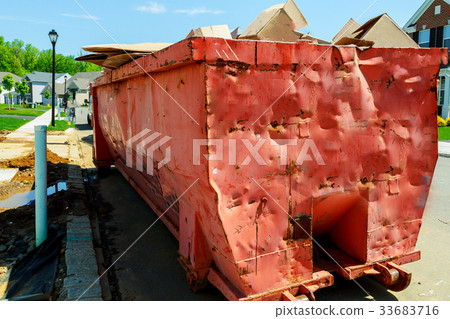 Dumpsters being full with garbage Dumpsters being full with garbage 33683716