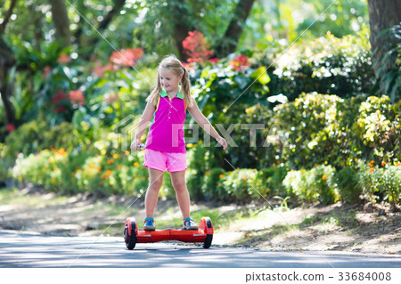 Child on hover board. Kids ride scooter. Child on hover board. Kids ride scooter. 33684008