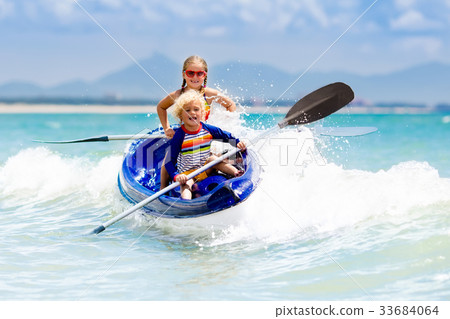 Kids kayaking in ocean. Children in kayak in sea 33684064
