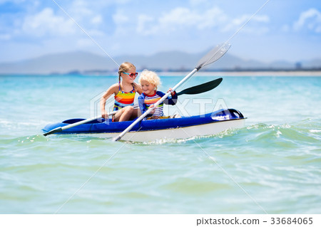 Kids kayaking in ocean. Children in kayak in sea 33684065