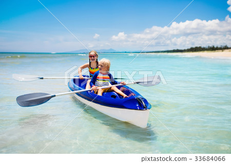 Kids kayaking in ocean. Children in kayak in sea 33684066