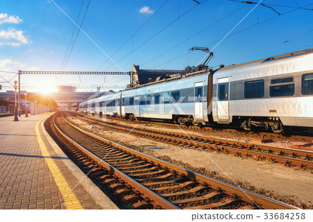 Beautiful passenger train at the railway station 33684258