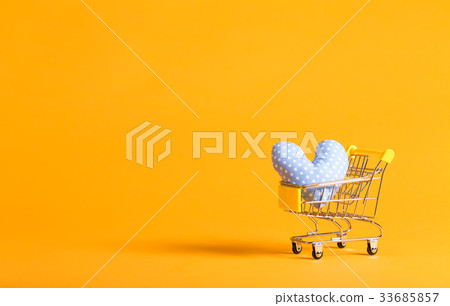 Shopping theme with shopping cart and heart shaped 33685857