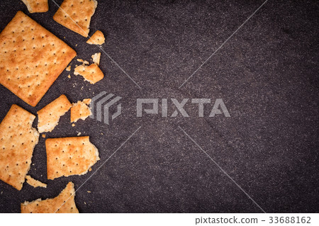 whole wheat crackers flat lay as border on black whole wheat crackers flat lay as border on black 33688162