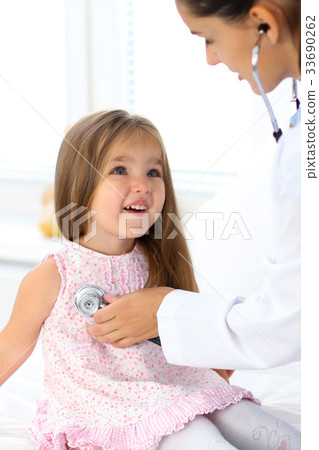 Doctor examining a little girl by stethoscope 33690262