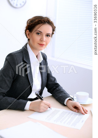 Business woman looks like yulia tymoshenko is 33690316