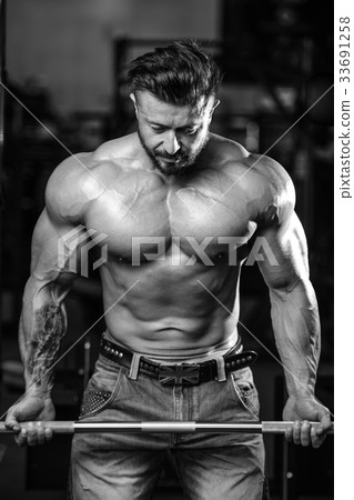 Handsome athletic man on diet training muscles Handsome athletic man on diet training muscles 33691258