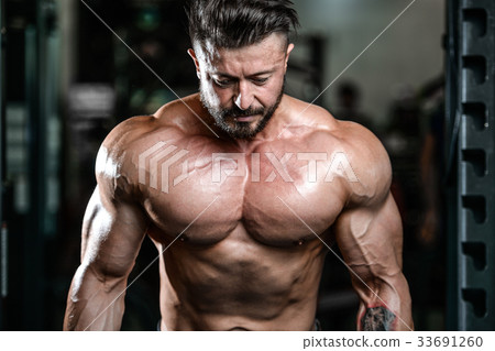 Handsome athletic man on diet training muscles Handsome athletic man on diet training muscles 33691260