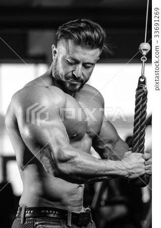 Handsome athletic man on diet training muscles 33691269