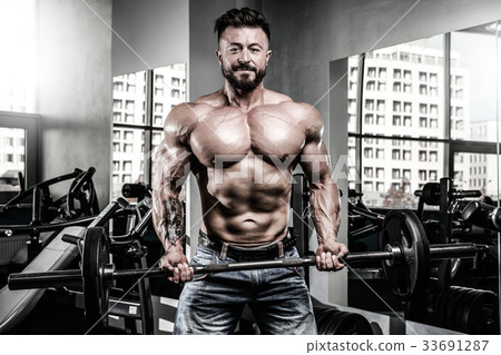 Handsome athletic man on diet training muscles 33691287