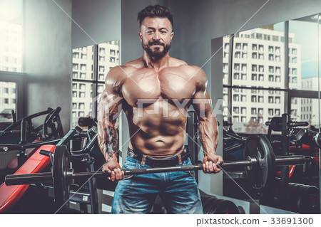 Handsome athletic man on diet training muscles 33691300