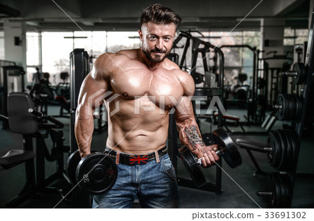 Handsome athletic man on diet training muscles 33691302
