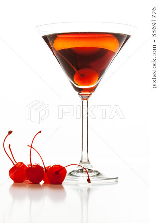 Manhattan cocktail garnished with a cherry 33691726