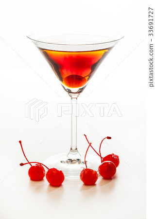 Manhattan cocktail garnished with a cherry 33691727
