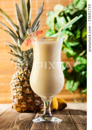 Pina Colada on wooden background 33691739