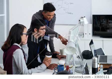 Programmers working in team Programmers working in team 33693111