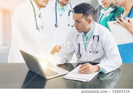 Doctor team meeting with laptop computer. 33697234