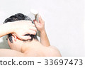 A man washing his head 33697473