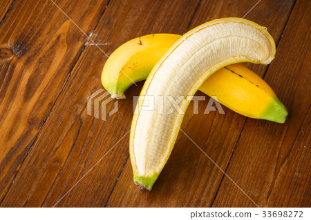 banch of bananas and a sliced banana banch of bananas and a sliced banana 33698272