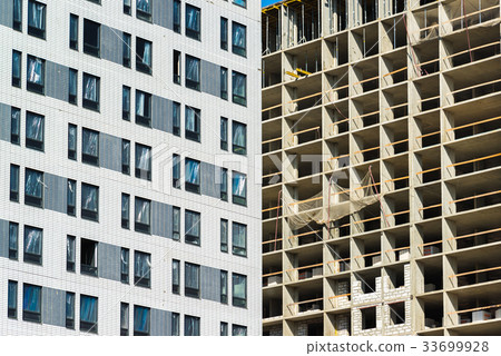 Construction of houses of different architecture 33699928