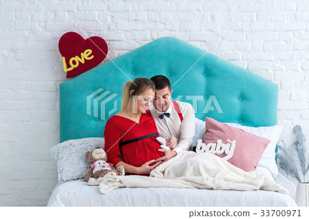 Couple lying on bed Couple lying on bed 33700971