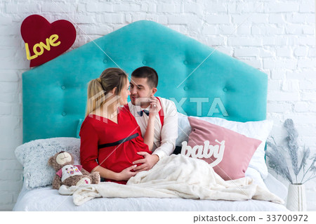 Couple lying on bed Couple lying on bed 33700972