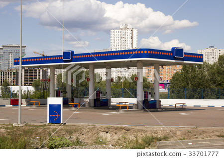 Gas station on blue sky background 33701777