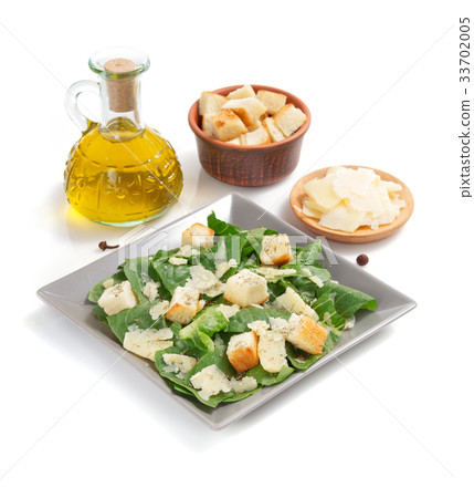 caesar salad in plate on white background 33702005