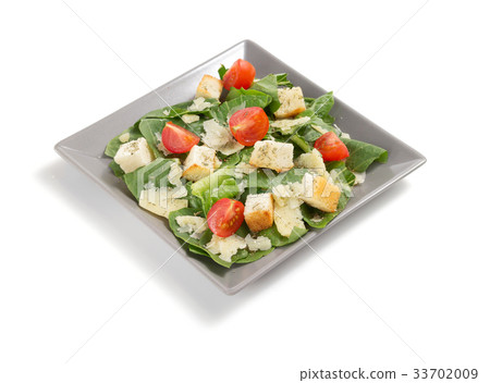 caesar salad in plate on white background caesar salad in plate on white background 33702009