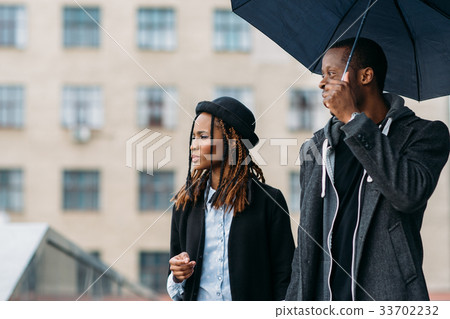 Thoughtful fashion pedestrians. Rainy mood Thoughtful fashion pedestrians. Rainy mood 33702232