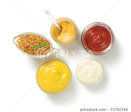 tomato sauce, mayonnaise and mustard on white 33702388