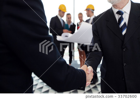 Business meeting of architects and investors Business meeting of architects and investors 33702600
