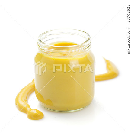 mustard sauce in jar on white 33702623