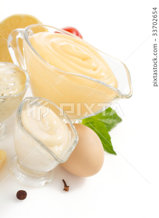 variety of mayonnaise sauce on white 33702654