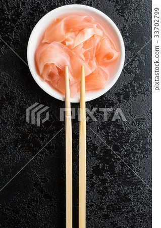 Pickled sushi ginger slices. 33702799