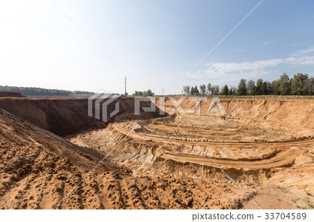Mining in a sand quarry with powerful machines 33704589
