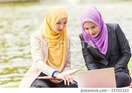 Muslim Businesswomen Discussing. Outdoor Concept 33705283