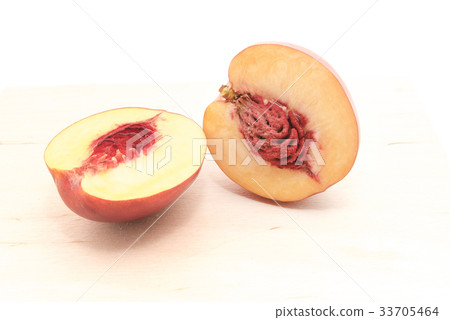Nectarine in a cut with a bone isolated on a white Nectarine in a cut with a bone isolated on a white 33705464