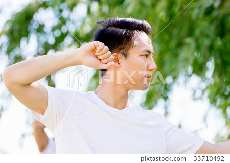 Handsome man practicing thai chi Handsome man practicing thai chi 33710492