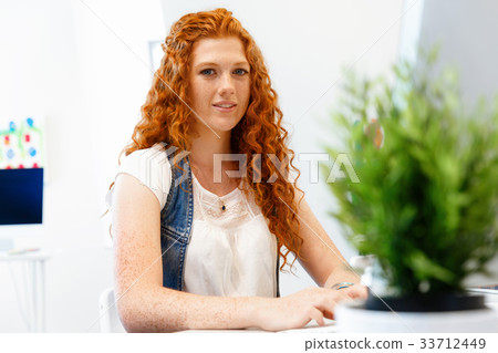Creative business woman in office Creative business woman in office 33712449
